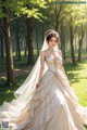 A woman in a wedding dress standing in a park.